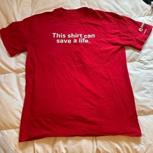 Red T-shirt with the saying “this shirt can save a life”